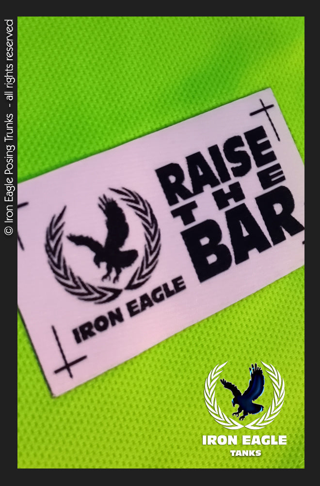 Neon green mesh posing trunks fabric with a white Iron Eagle Raise the Bar logo label and black emblem. - Iron Eagle Training Tank - Flo Green - S