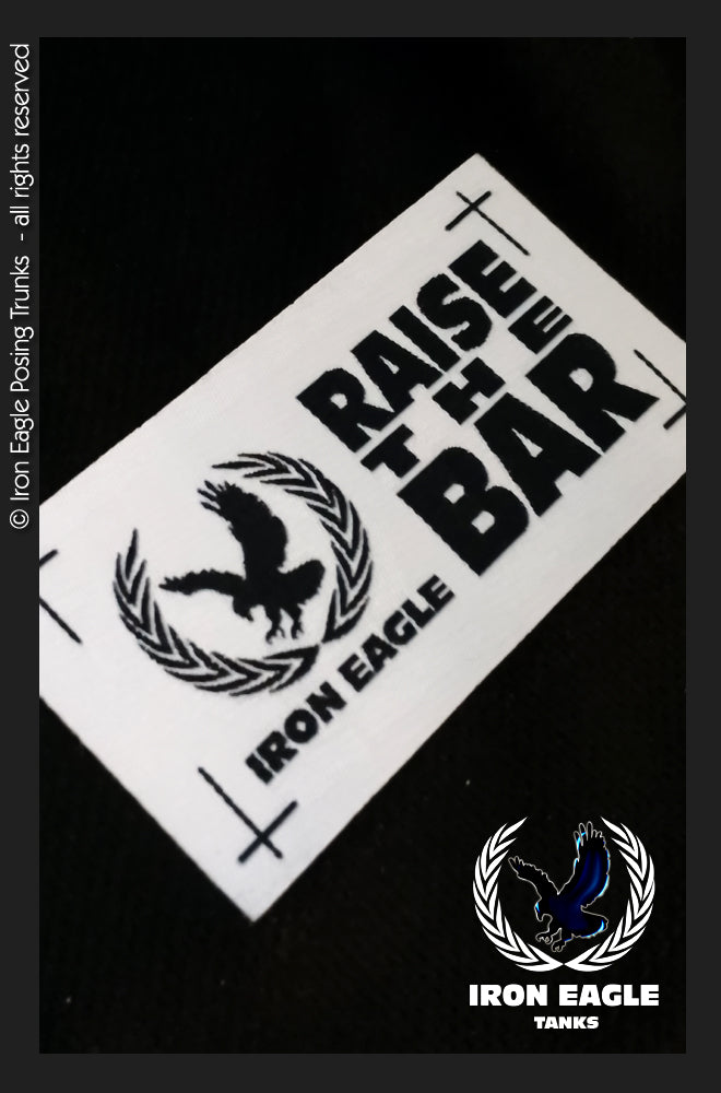 Black Iron Eagle logo sticker with bold “Raise the Bar” lettering and eagle graphic. - Iron Eagle Training Tank - Black - S