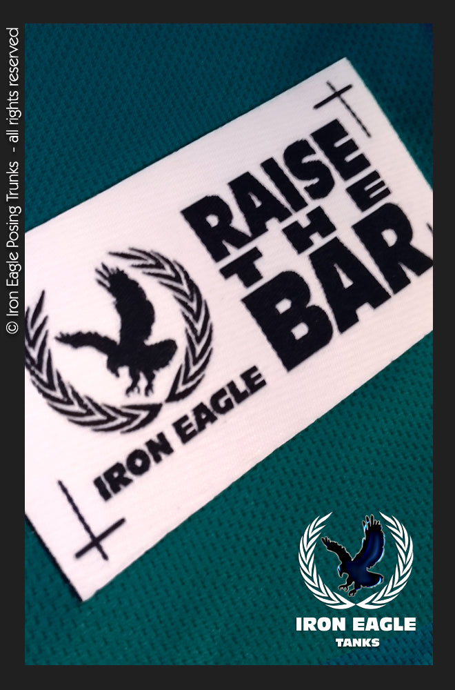 Teal Iron Eagle label with bold black “Raise the Bar” lettering and eagle logos. - Iron Eagle Training Tank - Teal - S