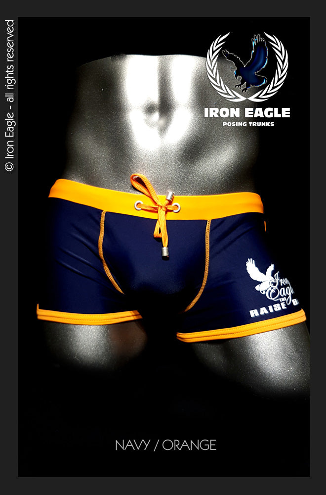 Navy low-rise posing trunks with bright orange waistband, trim, and drawstring, plus white side graphics. - Low Rise Trunks - navy/orange - M / With