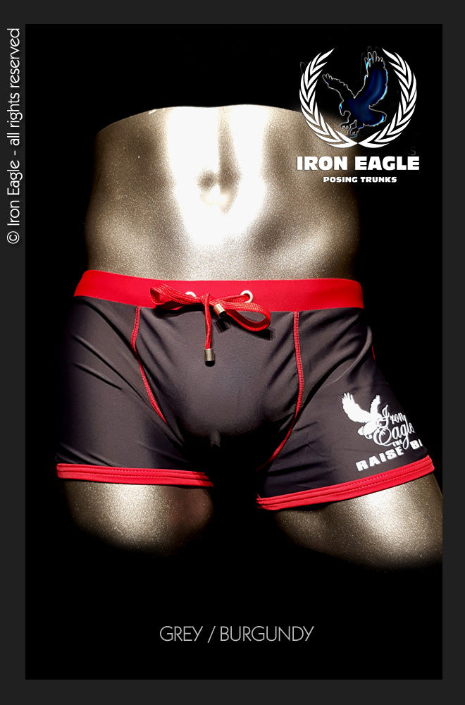 Grey and burgundy low-rise posing trunks with red trim, drawstring waist, and side graphics. - Low Rise Trunks - grey/burgundy - M / With