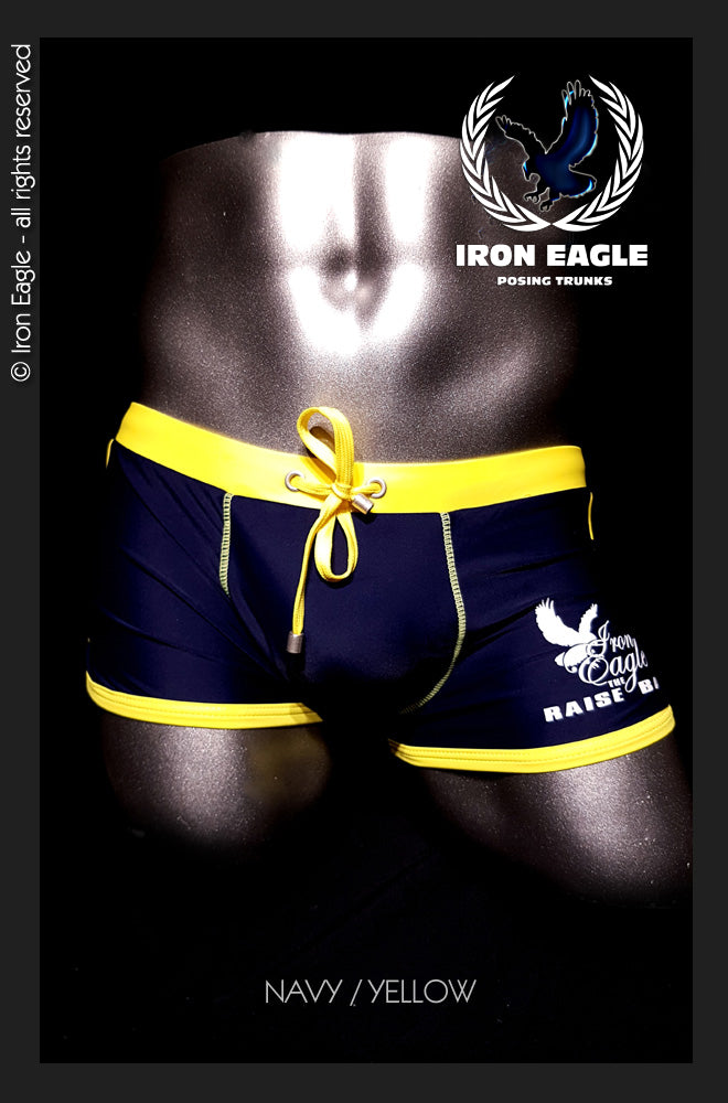 Navy posing trunks with bright yellow trim, a yellow drawstring, and white eagle graphics. - Low Rise Trunks - navy/yellow - M / With