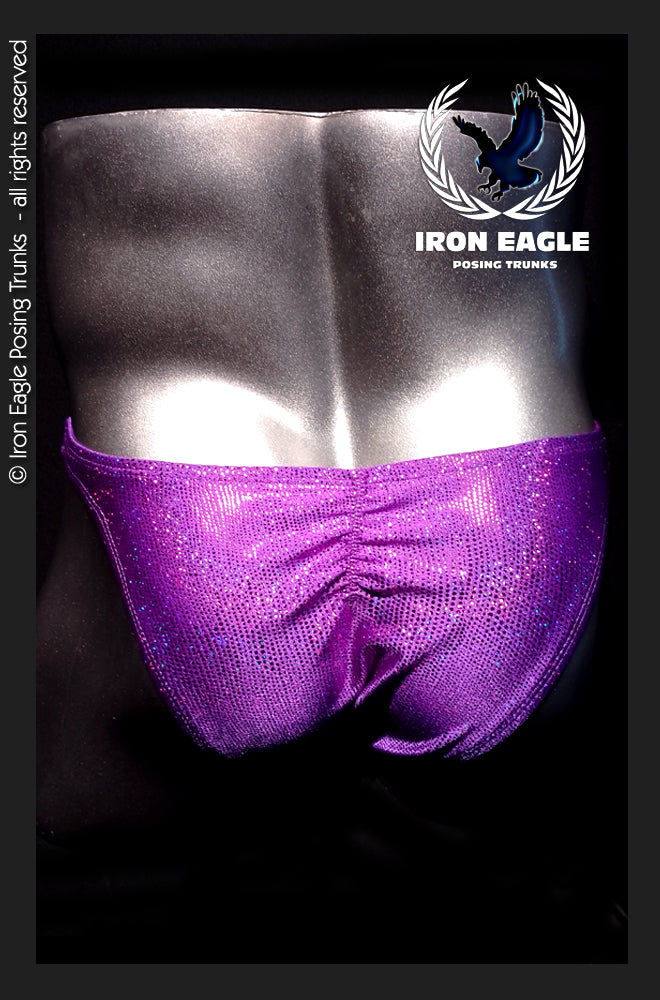 Shimmering purple posing trunks with a ruched front and sparkling finish, modeled on a physique competitor. - Purple Dazzle Mystique - Premier / S / With
