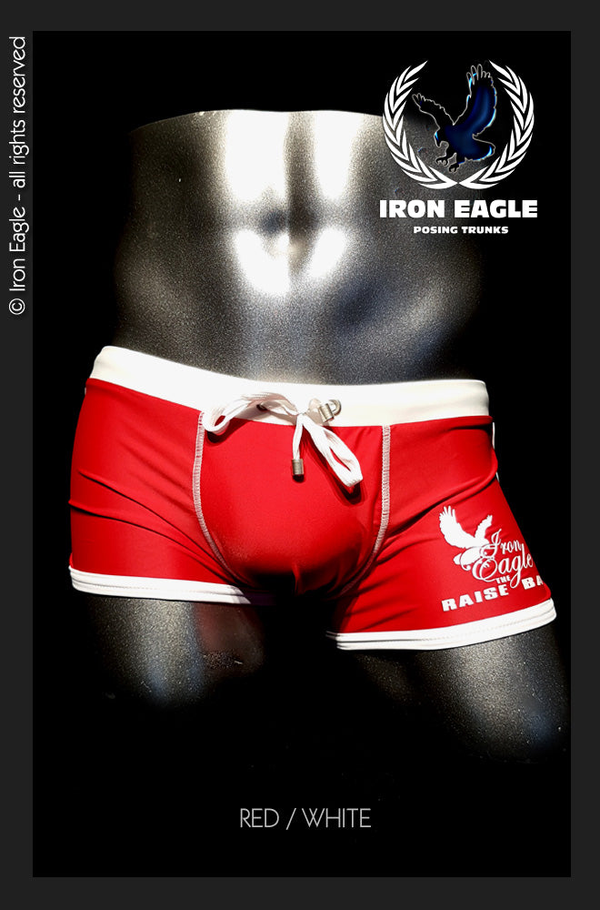 Red and white low-rise posing trunks with a white drawstring and bold side lettering. - Low Rise Trunks - red/white - M / With